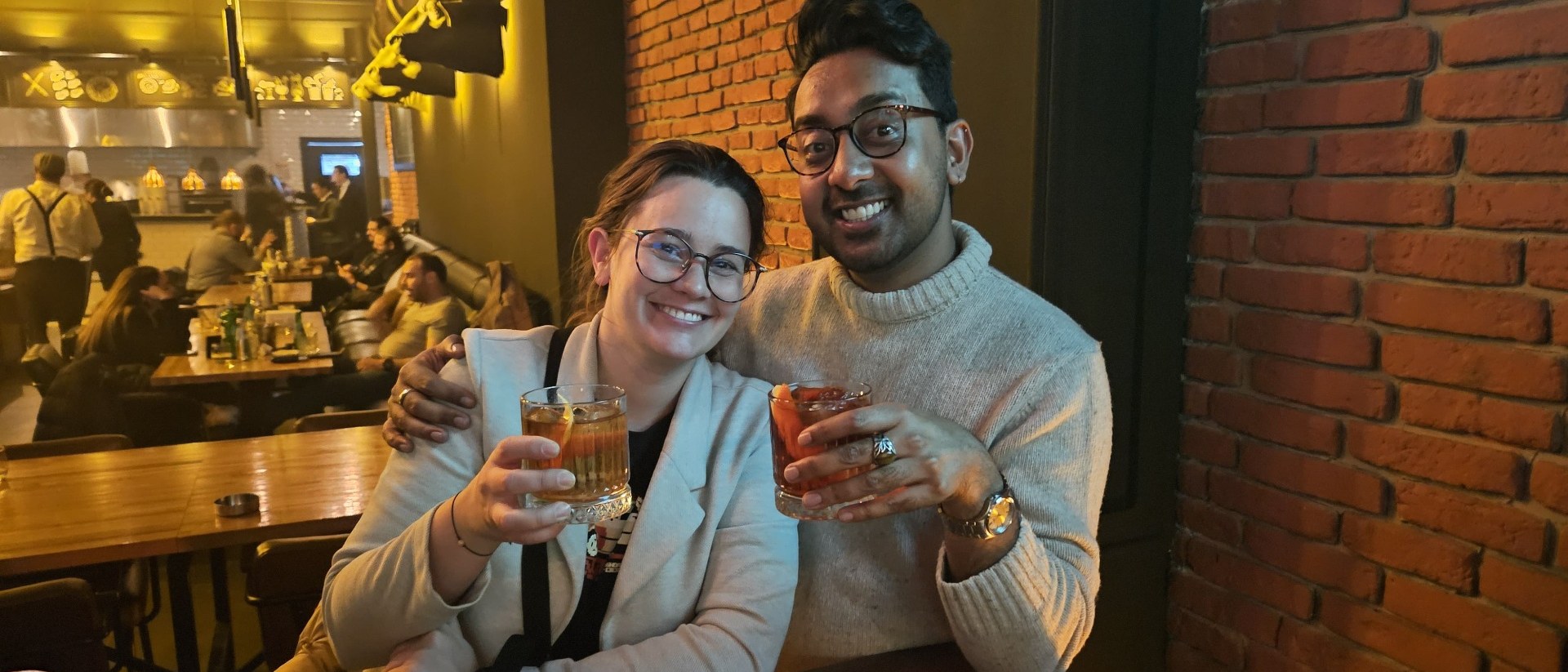 Couple cheering with cocktails