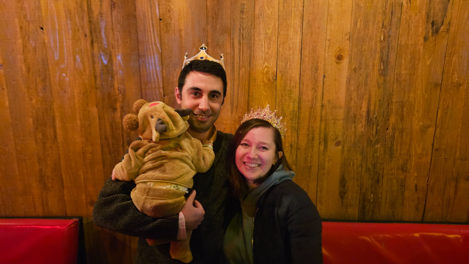 Couple with crowns and stuffed animal