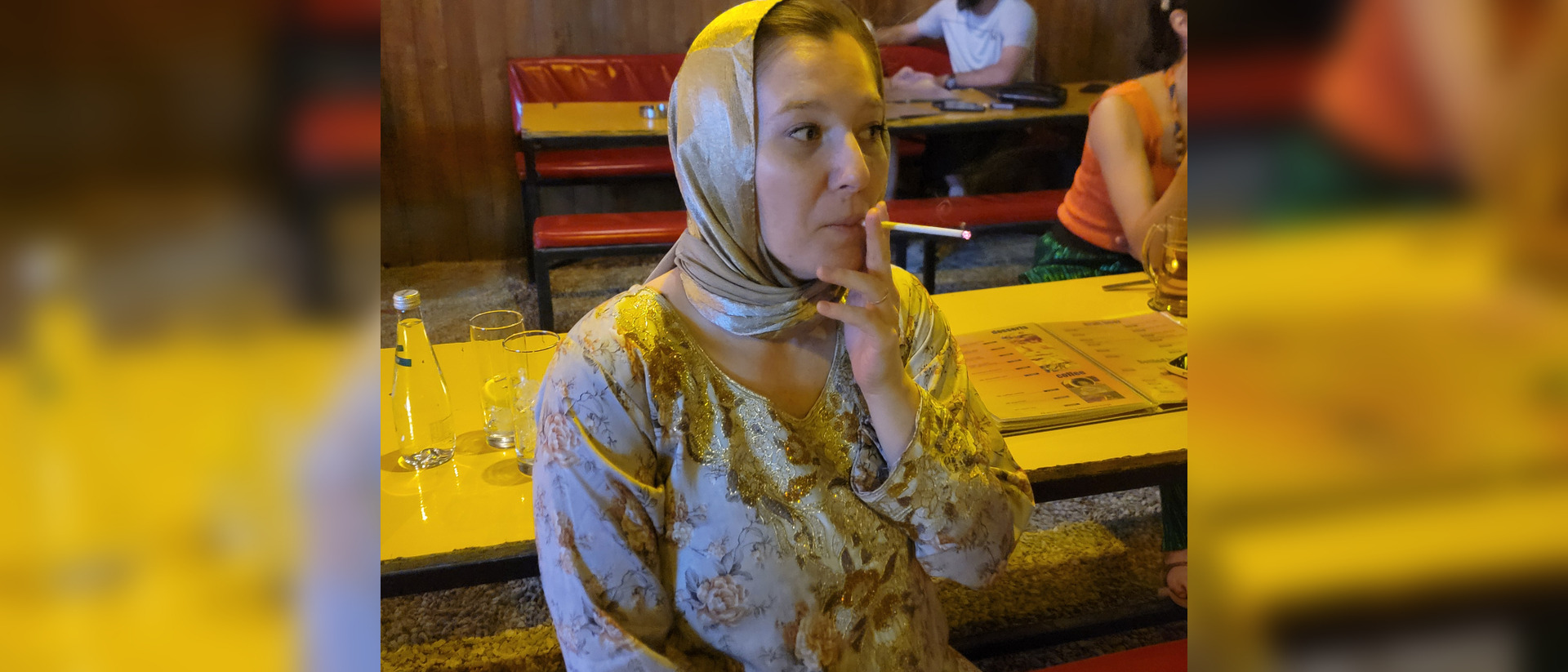 Friend in a golden headscarf at a cafe